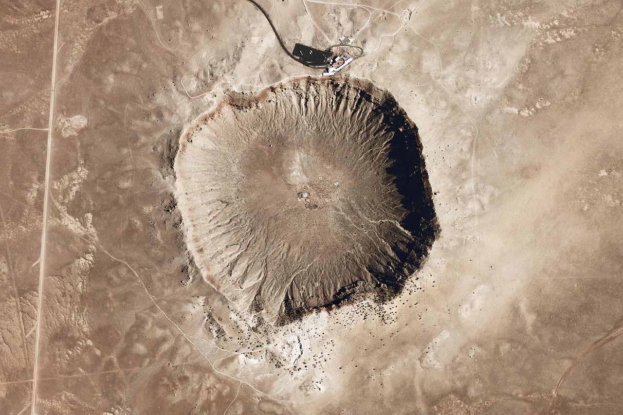 The outline of a large crater in a desert