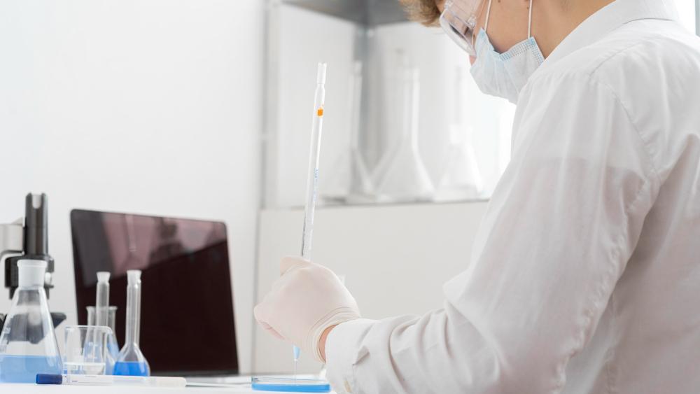 A photograph of a scientist working in their lab