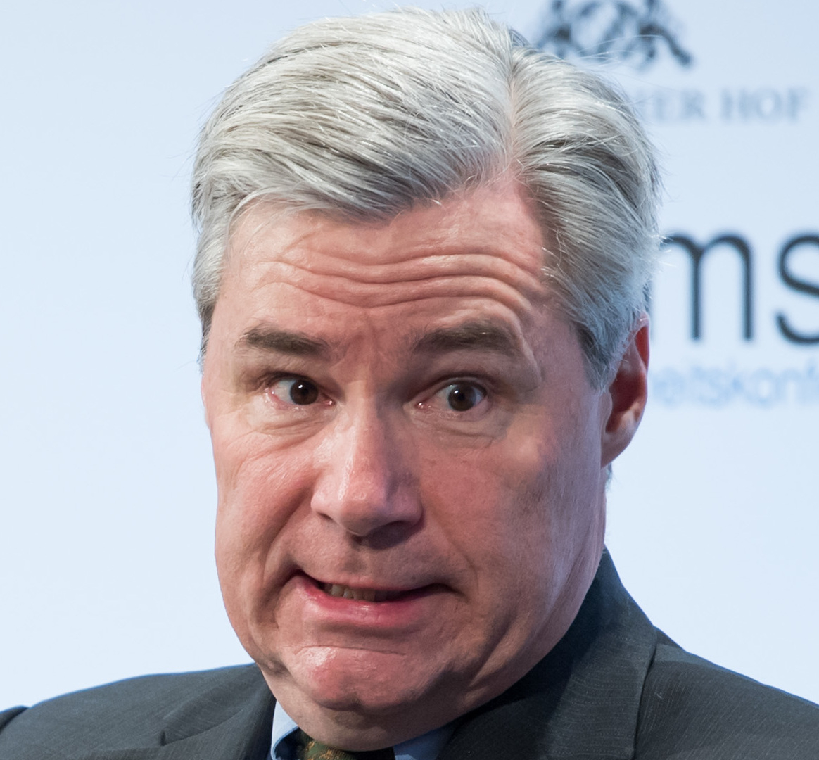 A photograph of Senator Sheldon Whitehouse pulling an unusual face