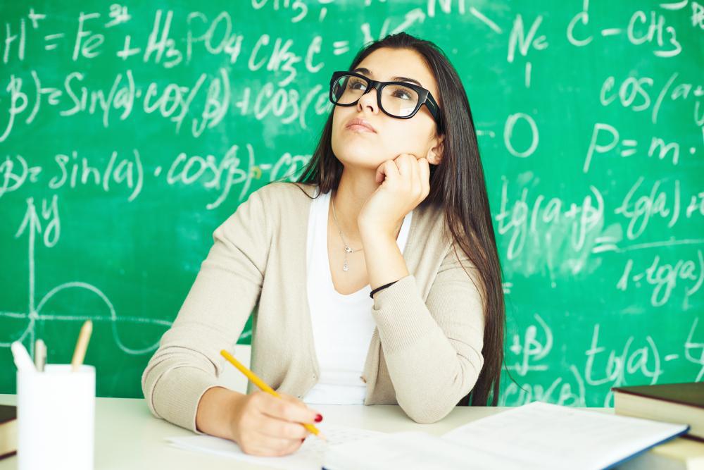 A photograph of a female scientist working at her desk
