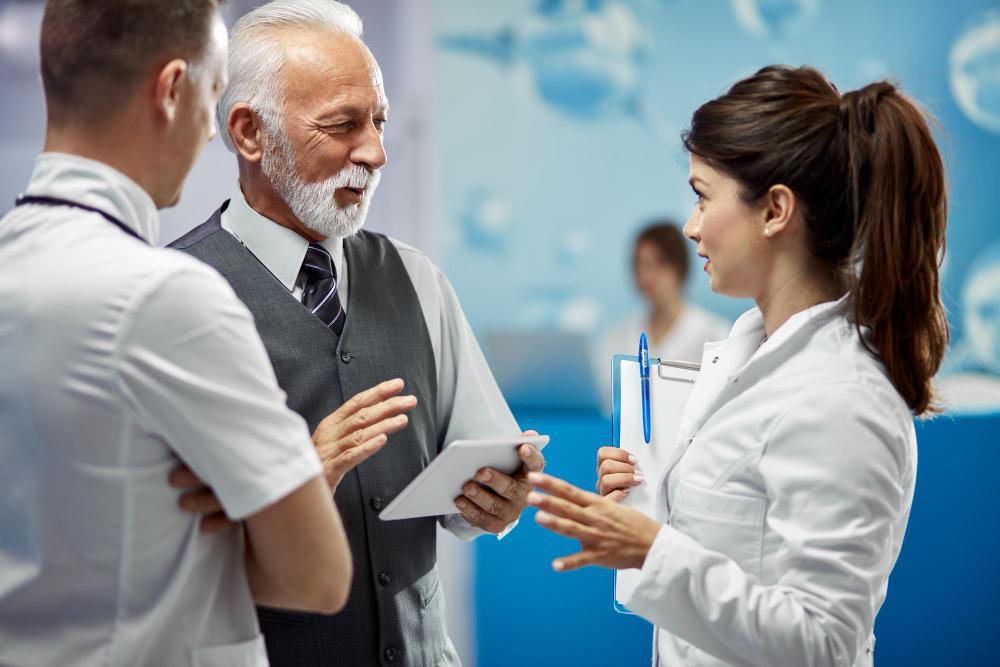 A photograph of several scientists having a conversation