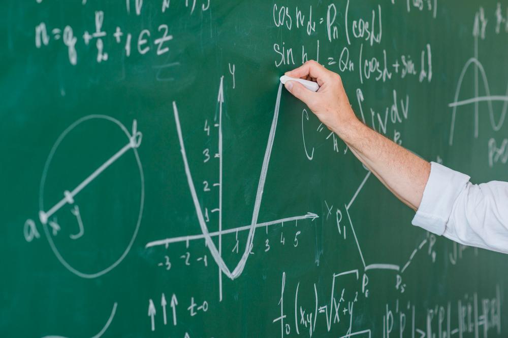 A photograph of a man solving an equation