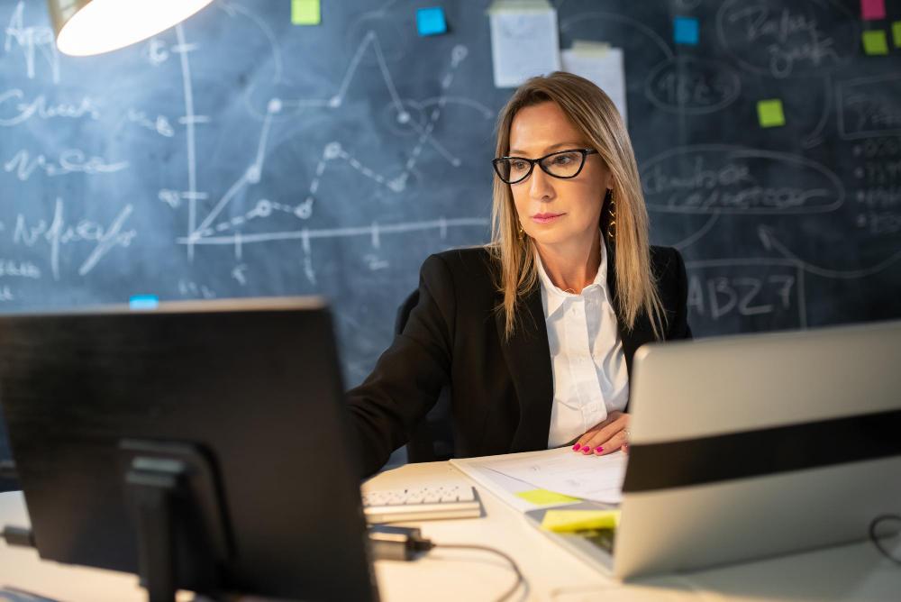 A photograph of a female research at her desk