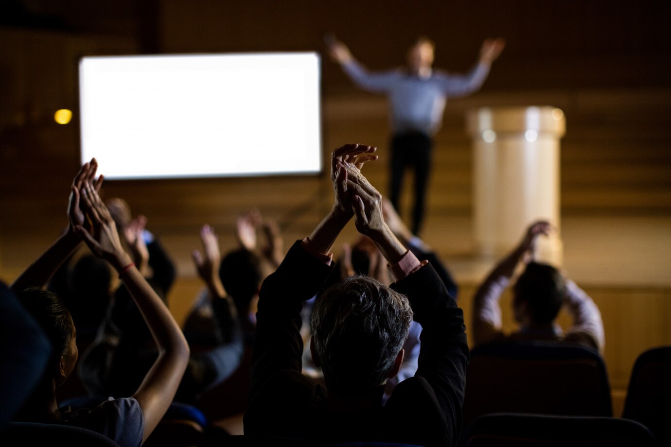 audience applauding speaker