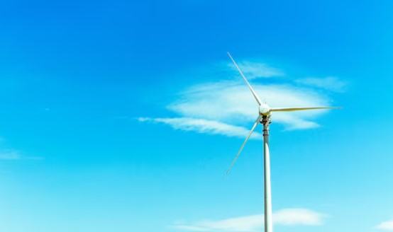 Wind turbine against blue sky with clean air