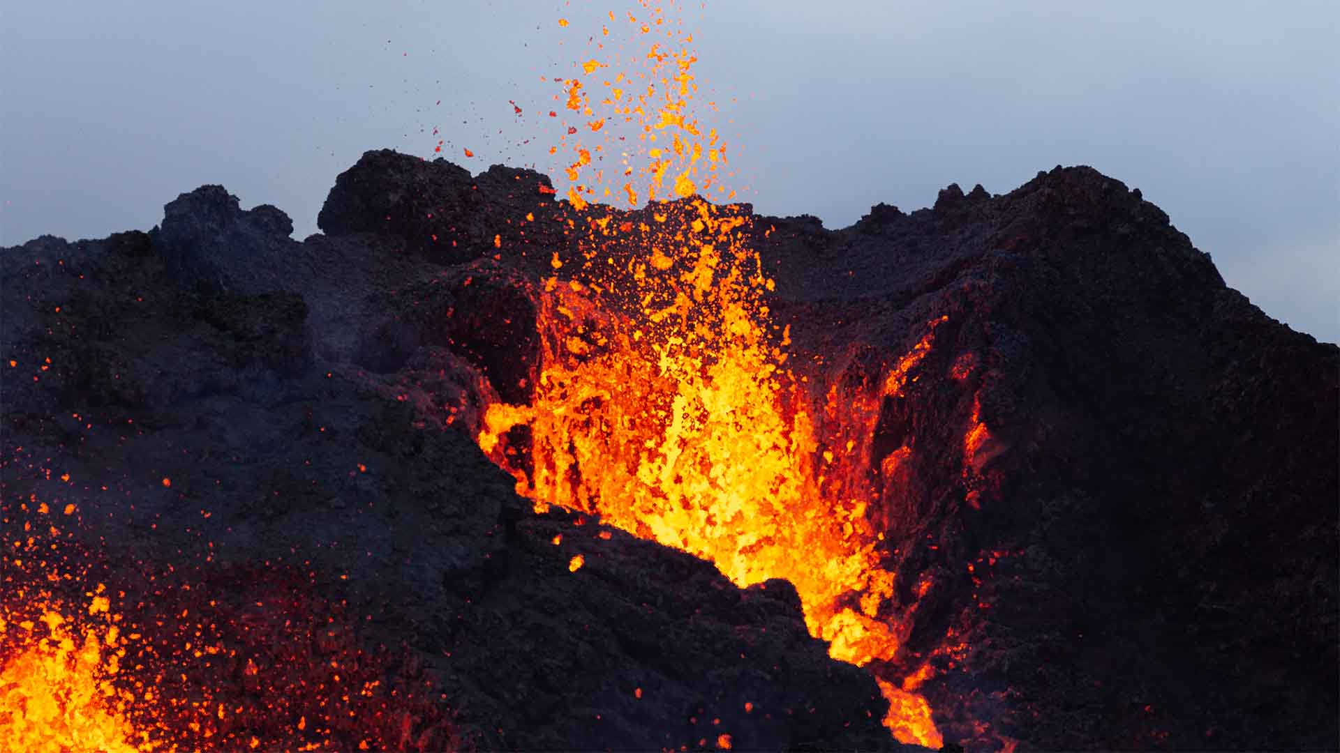 Lava erupts from the volcano's two craters on March 28, 2021 on the Reykjanes Peninsula, Iceland.