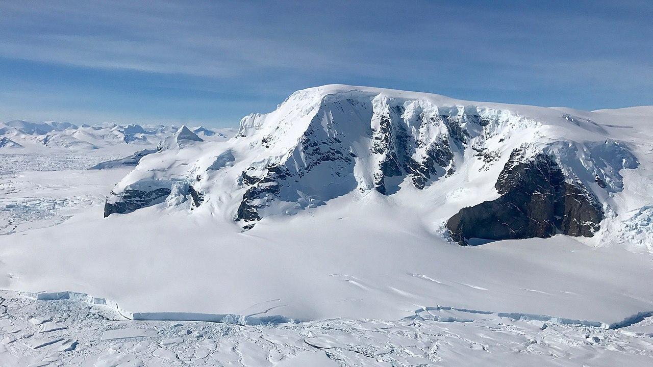 A photograph of a large mountain in Antarctica
