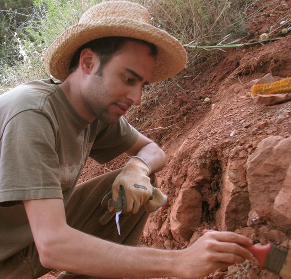 Photograph of an archaeologist working at a site