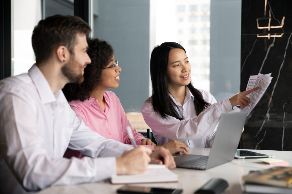 A photograph of several researchers seated at their shared desk