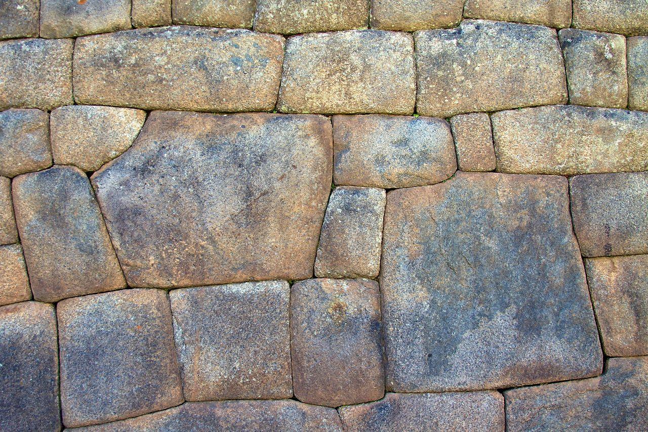 A photograph of the polygonal walls seen at Machu Picchu in Peru