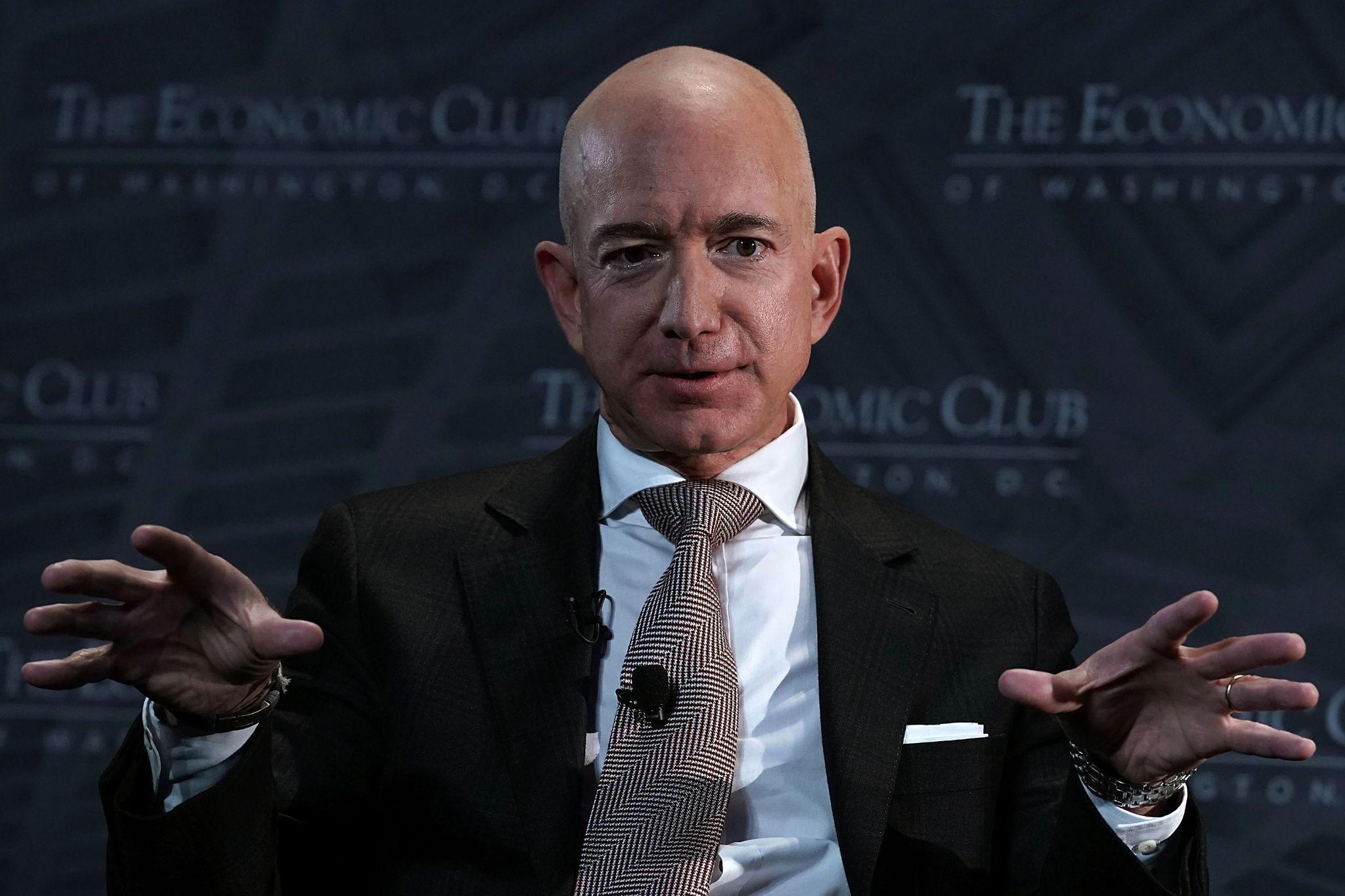 A photograph of Jeff Bezos during a talk
