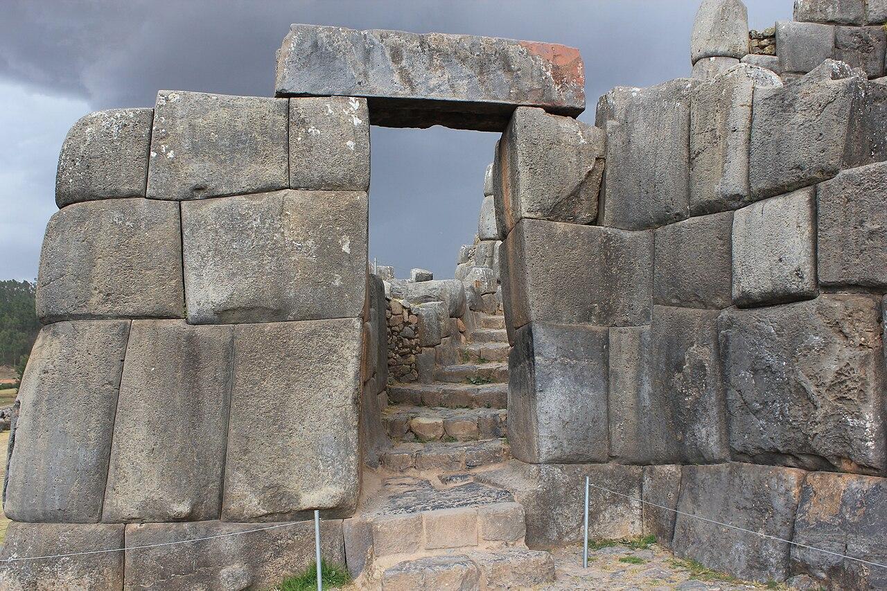 A photograph of an enormous stone doorway at Sacsayhuaman