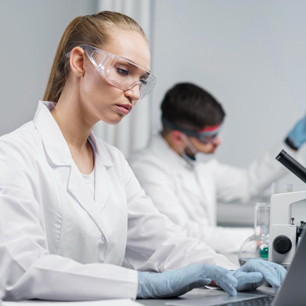 A photograph of researchers conducting an experiment in their lab