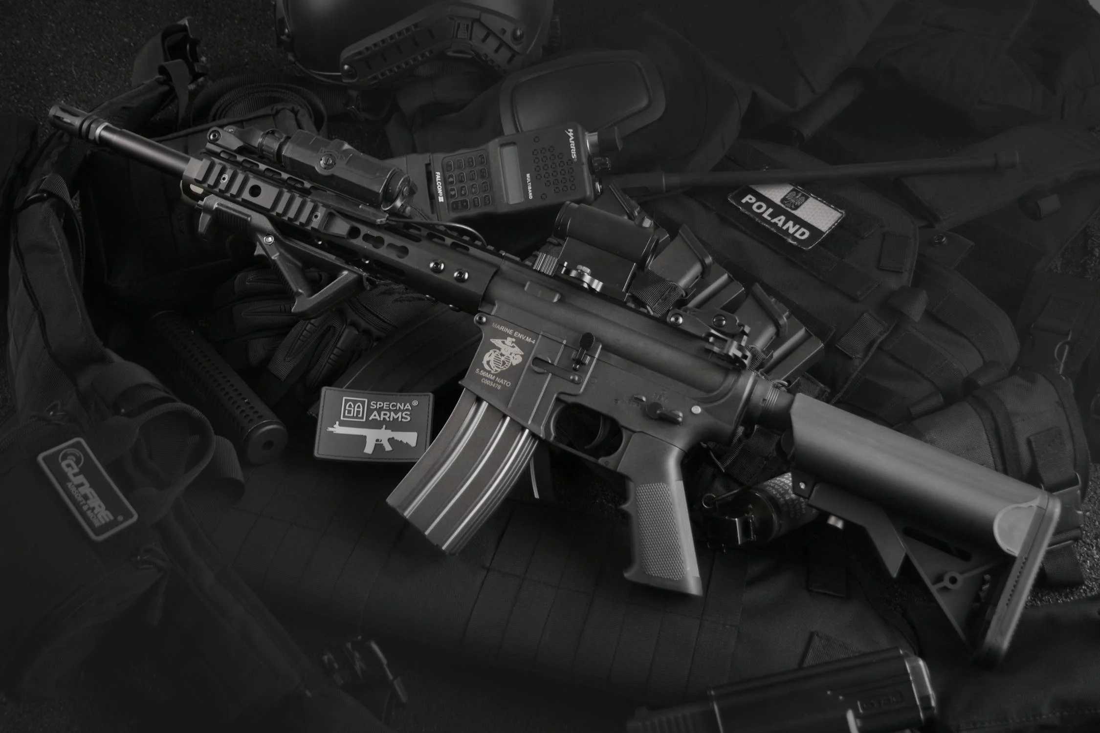A black rifle against a black background