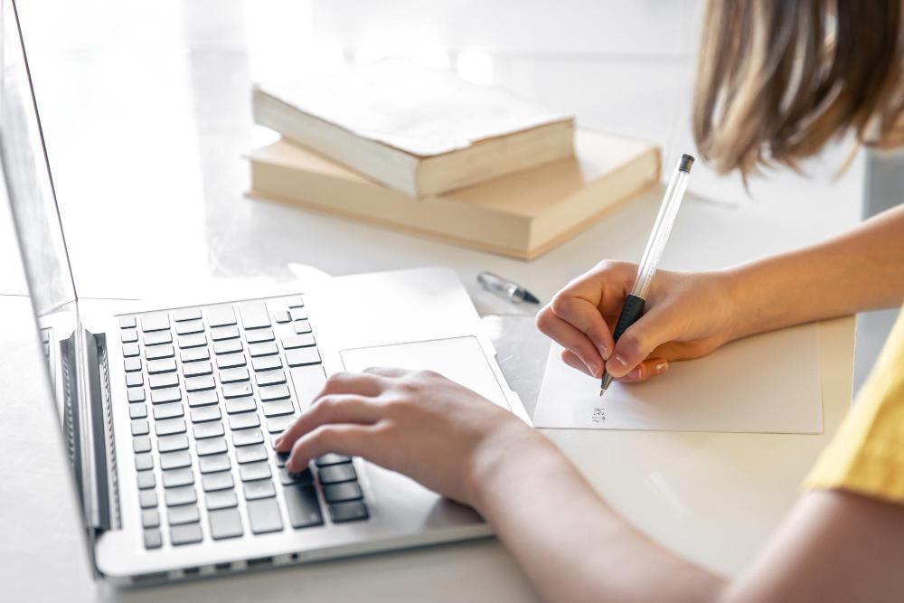 A photograph of a researcher working at her desk