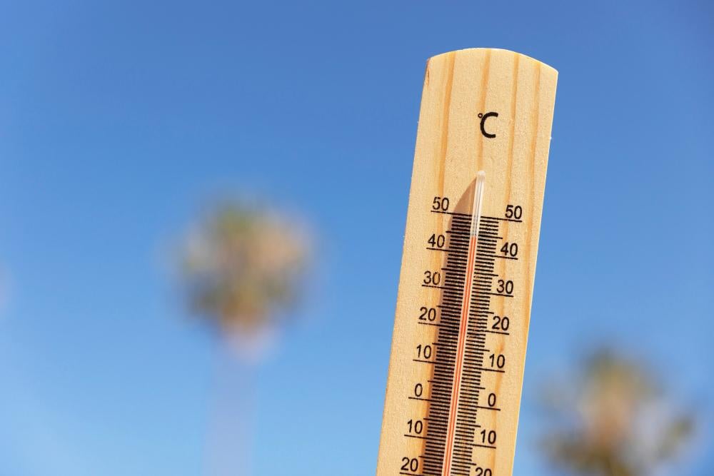 A photograph of a thermometer outdoors