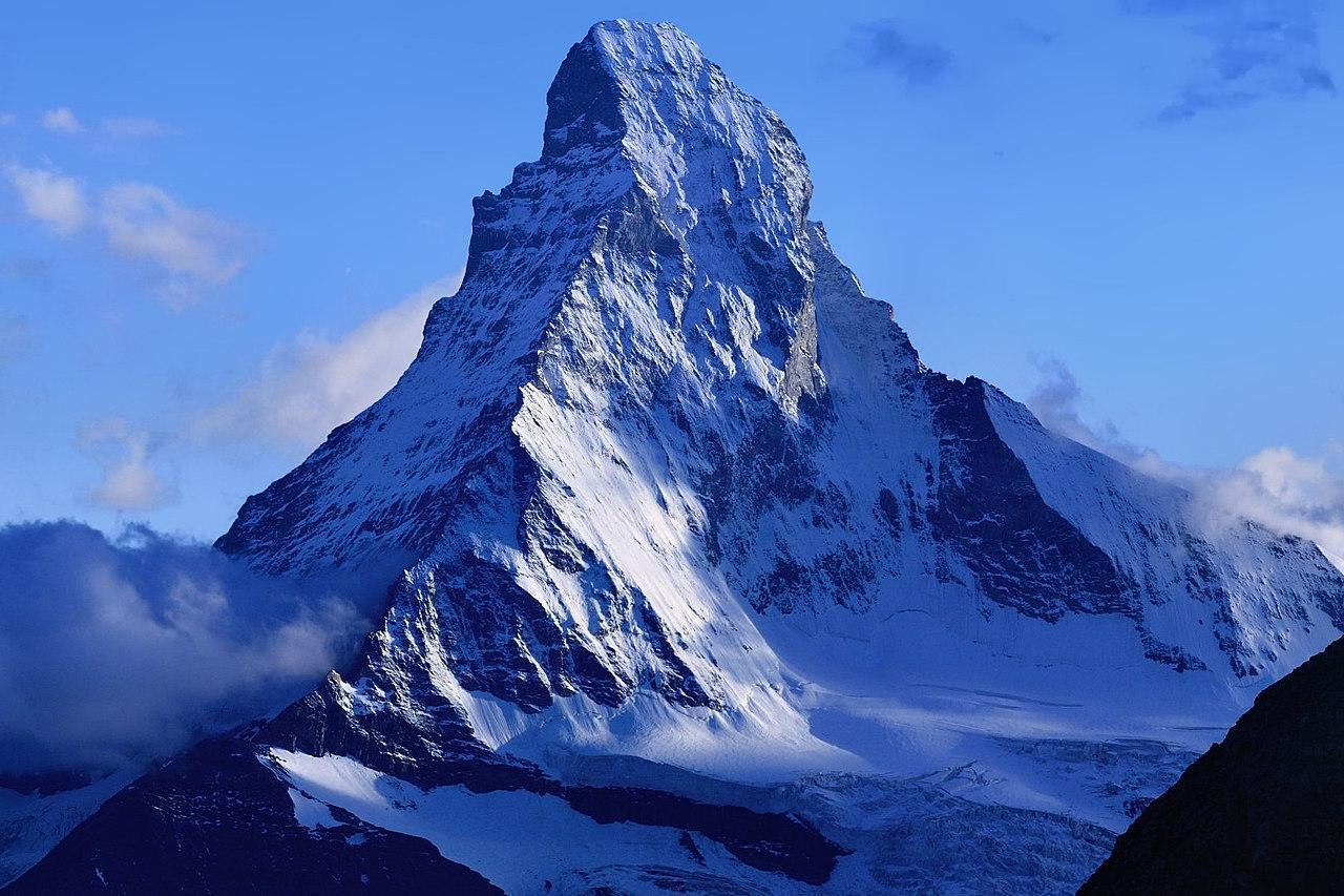 A photograph of a large mountain in the Alps