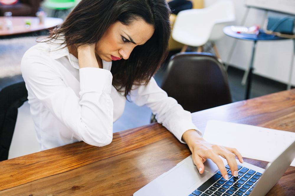A photograph of a researcher at her desk