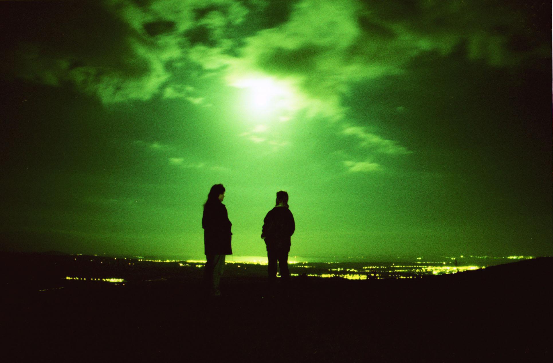 A group of UFO hunters pictured on a cliff in the United Kingdom