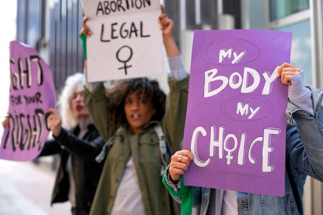 A photograph of a woman adhered to at an abortion rally
