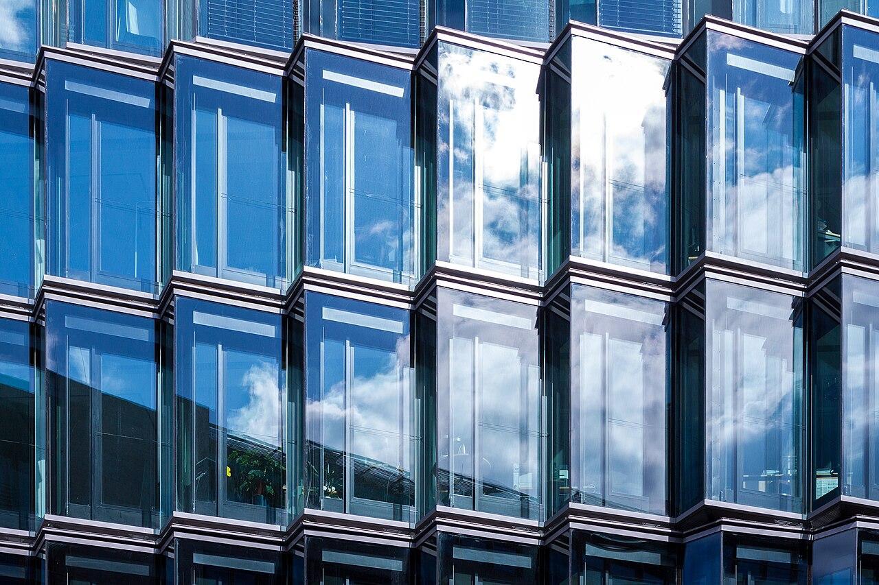 Glass panels pictured on the side of a large building