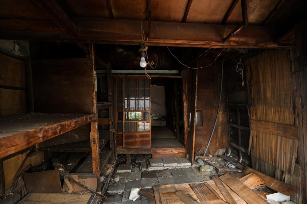 A photograph showcasing the interior of an abandoned home