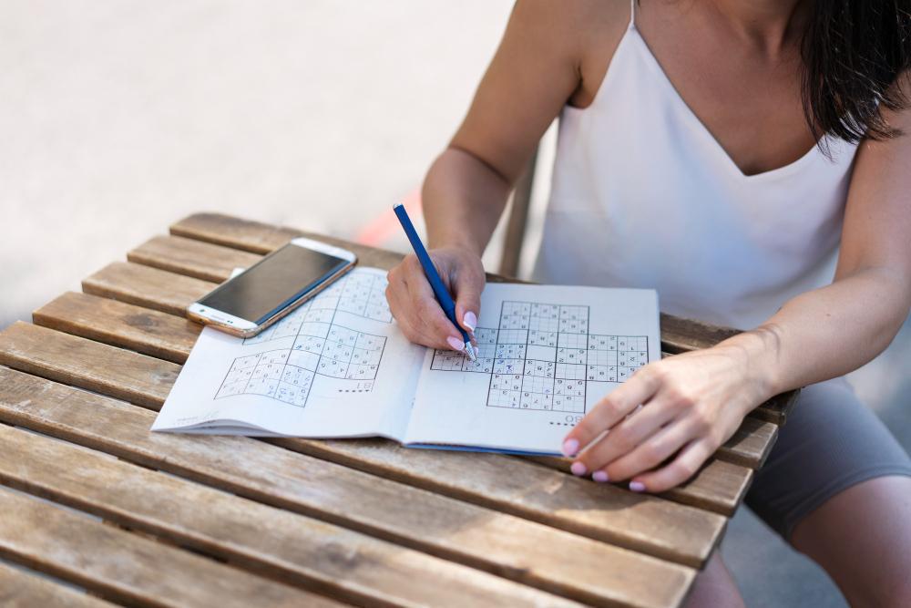 A photograph of a woman working on a puzzle