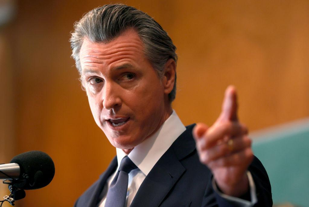 A photograph of Gavin Newsom with his finger extended