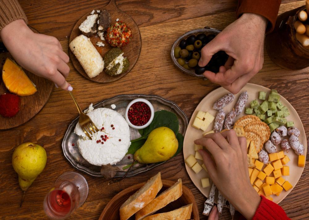 A photograph of friends enjoying a small feast together