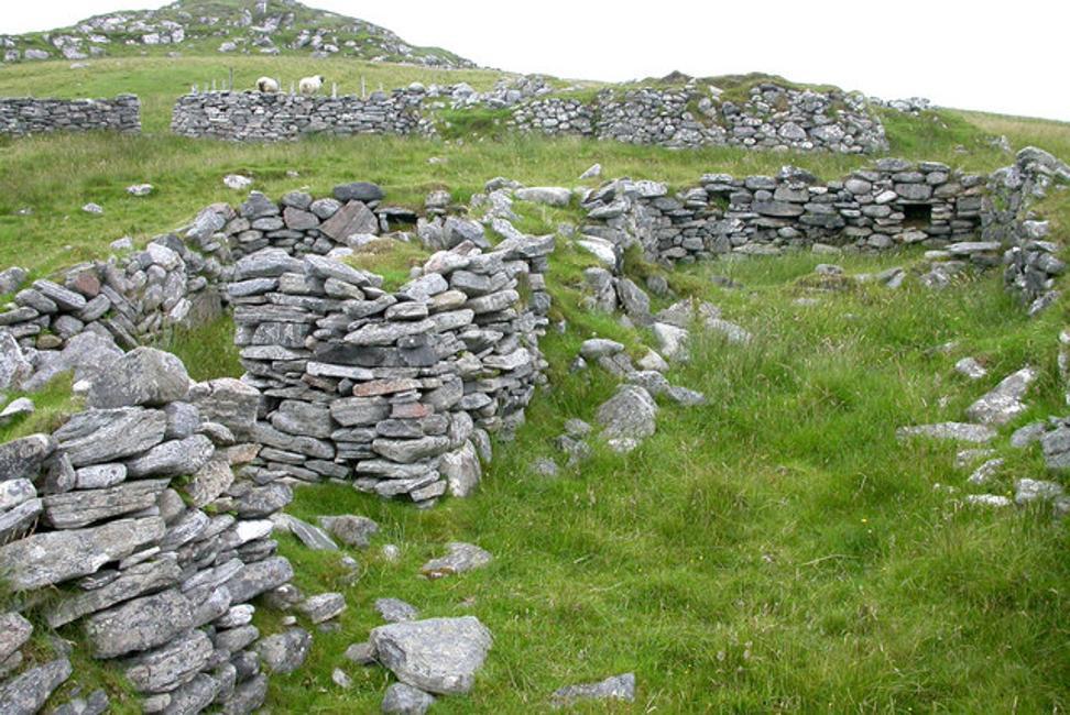 A photograph of ruined homes in the Scottish Highlands