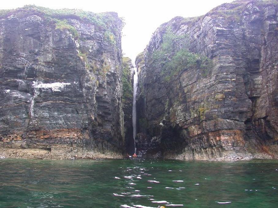 A photograph of a waterfall on Rum