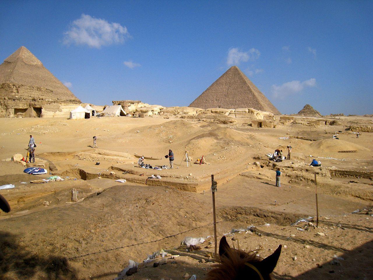 A photograph depicting the landscape surrounding the Giza pyramids