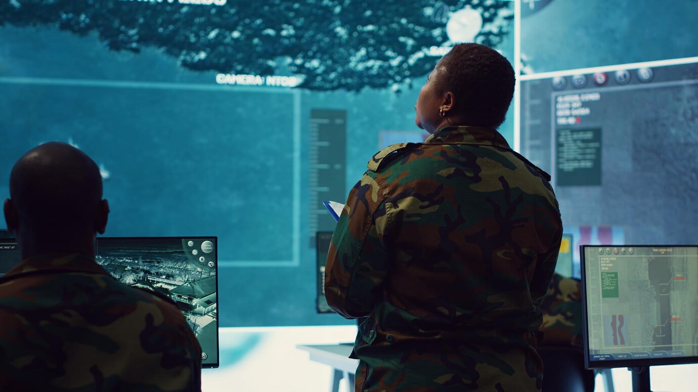 Soldier in a special operation monitoring room