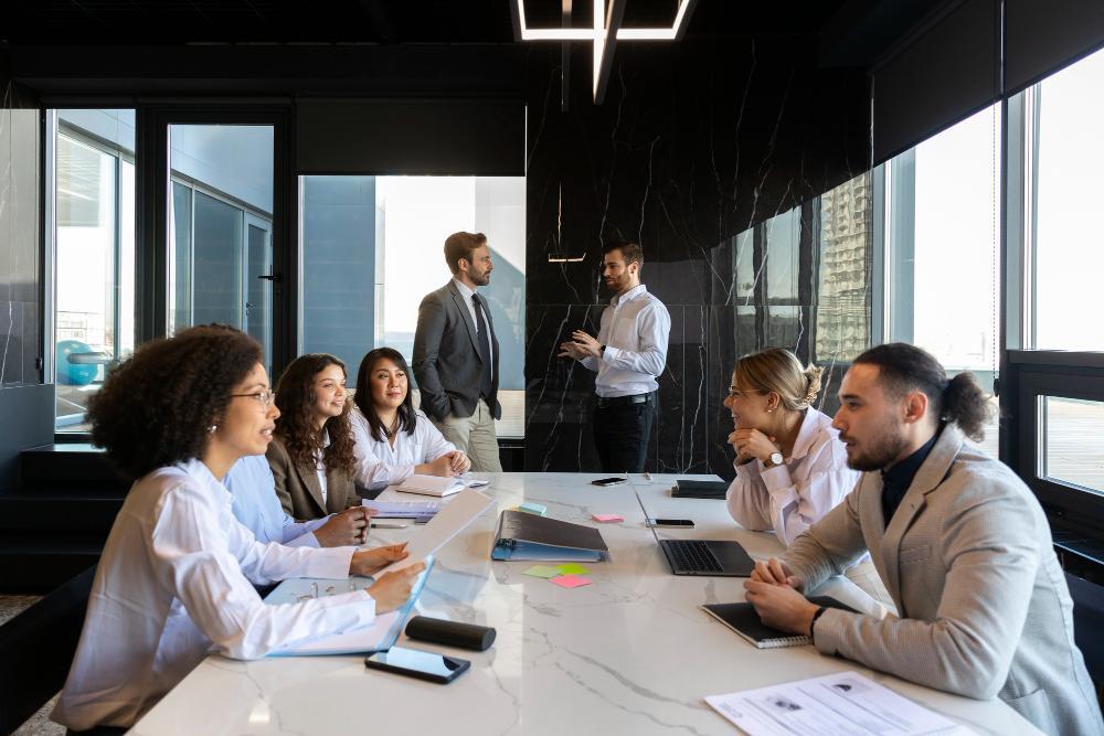 A large group of people pictured at a meeting