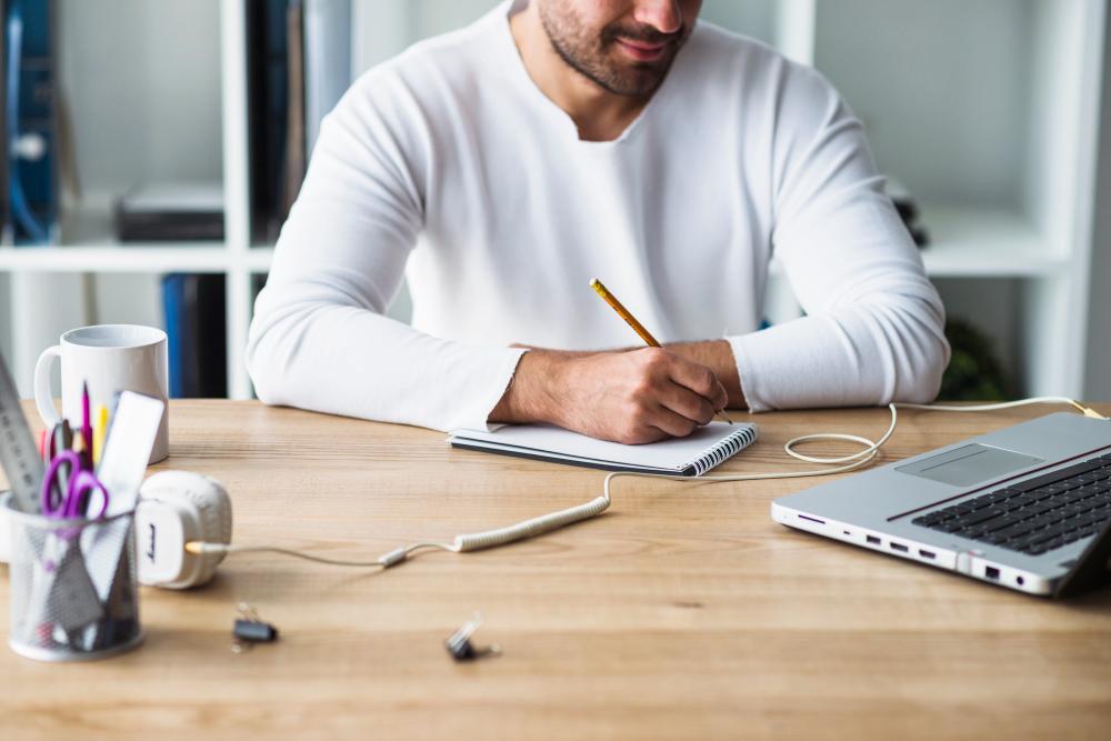 A photograph of a researcher working at his desk
