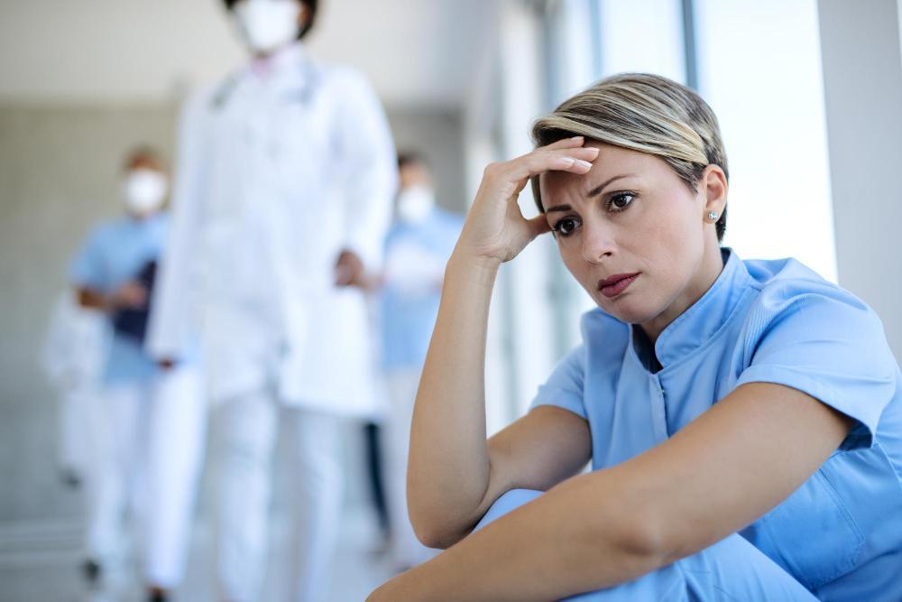 A photograph of an unhappy healthcare worker