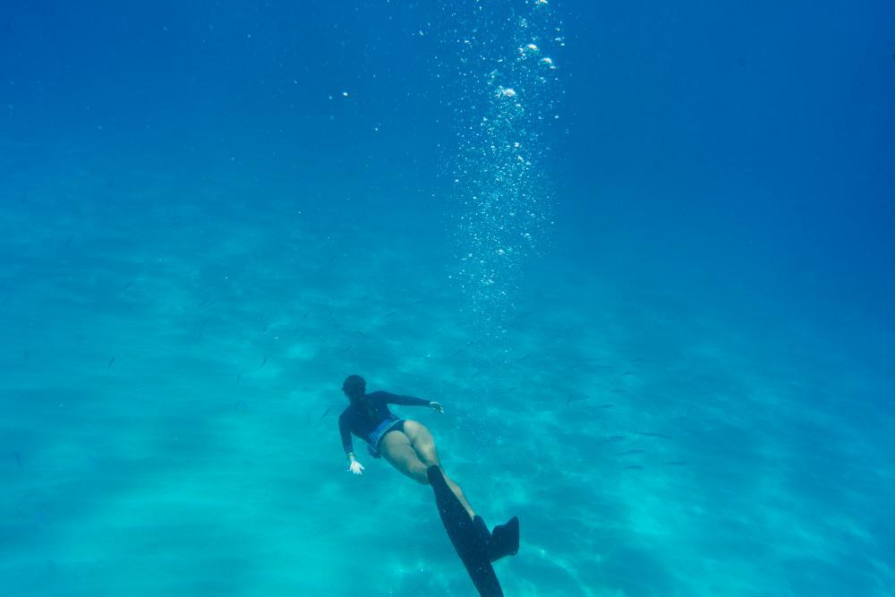 A photograph of a female diver