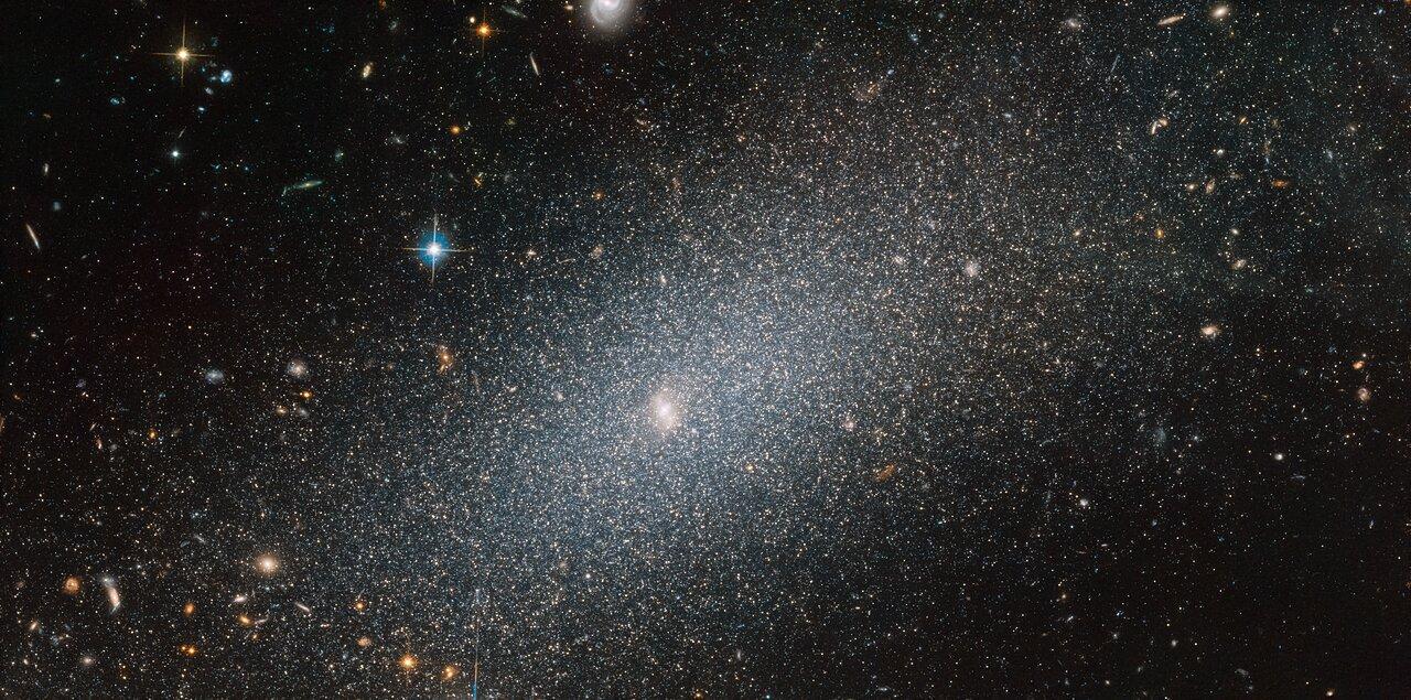 A photograph of a faint dwarf galaxy in deep space
