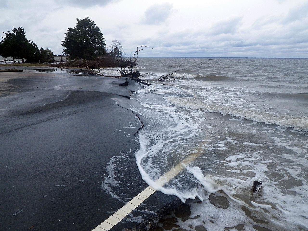 A photograph of a road dropping into the sea