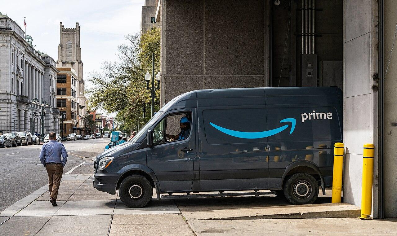 A photograph of an Amazon Prime truck parked in a city