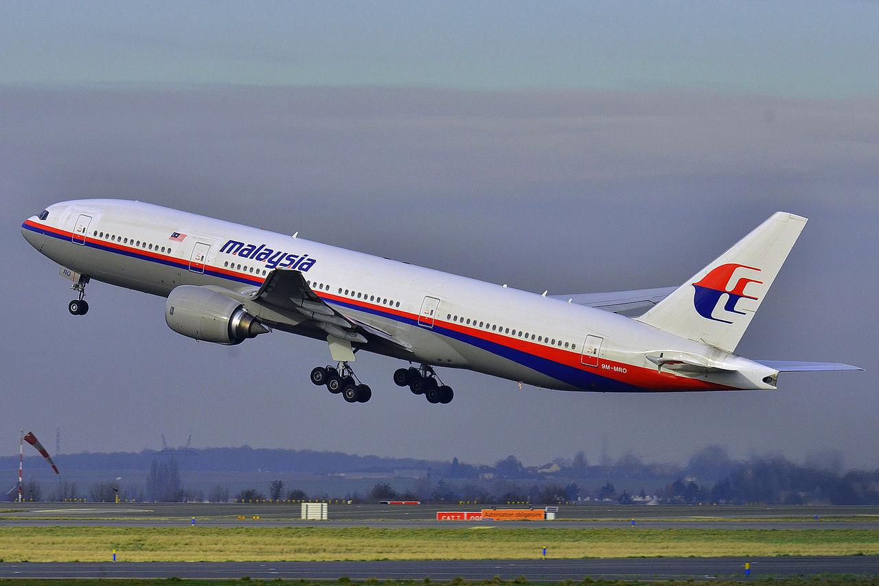 A photograph of a large Boeing plane
