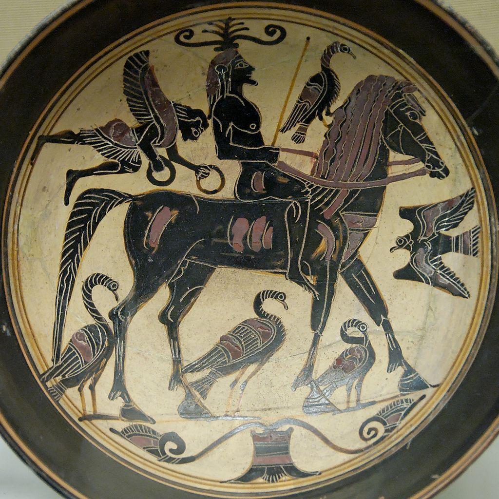 A depiction of a Spartan warrior on a small plate-like object