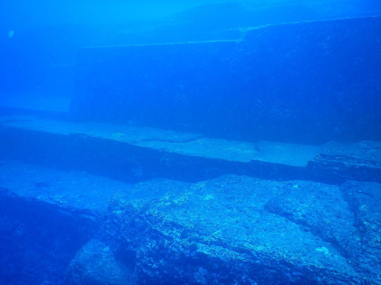 A photograph of a monument underwater