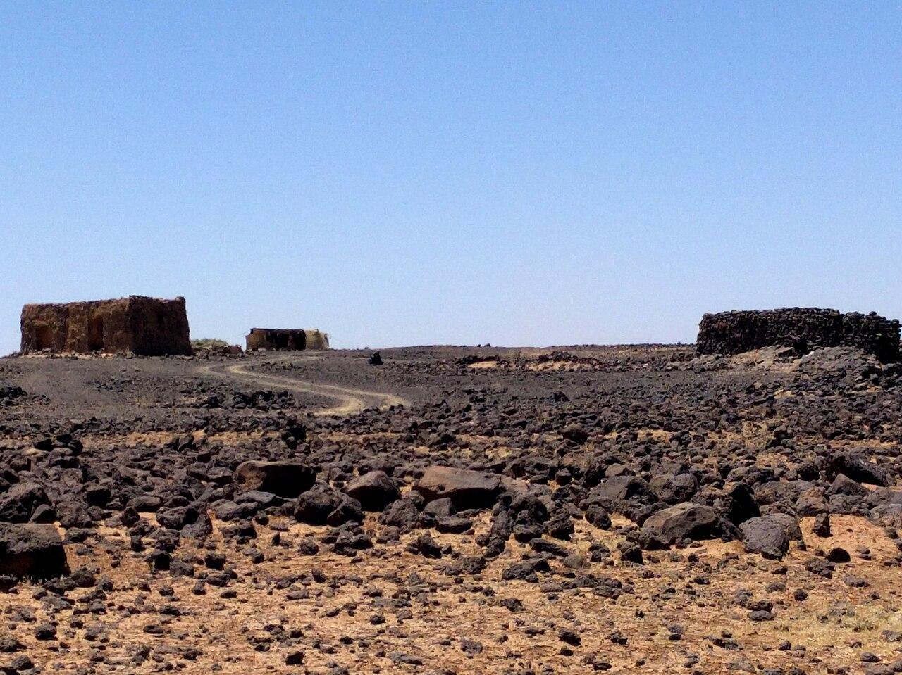 A photograph of abandoned homes in the Black Desert