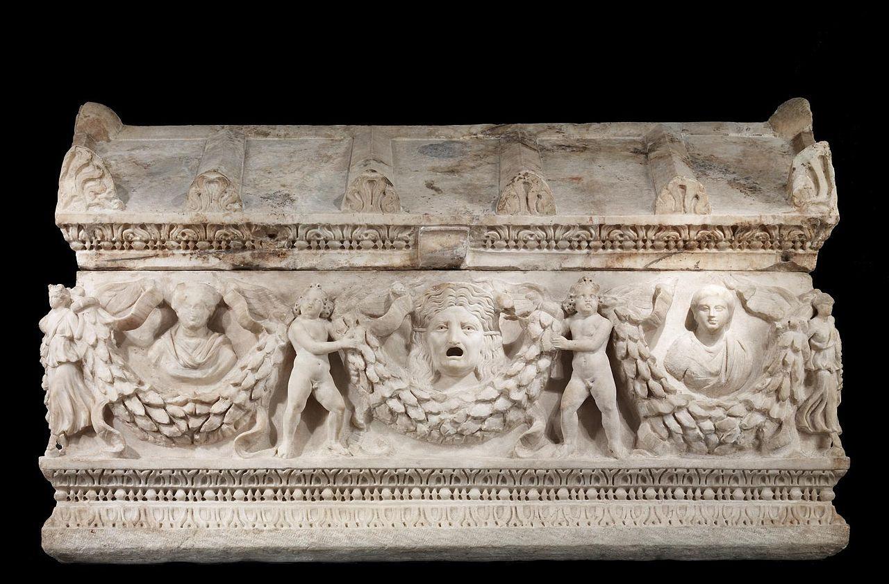 A photograph of a large stone sarcophagus
