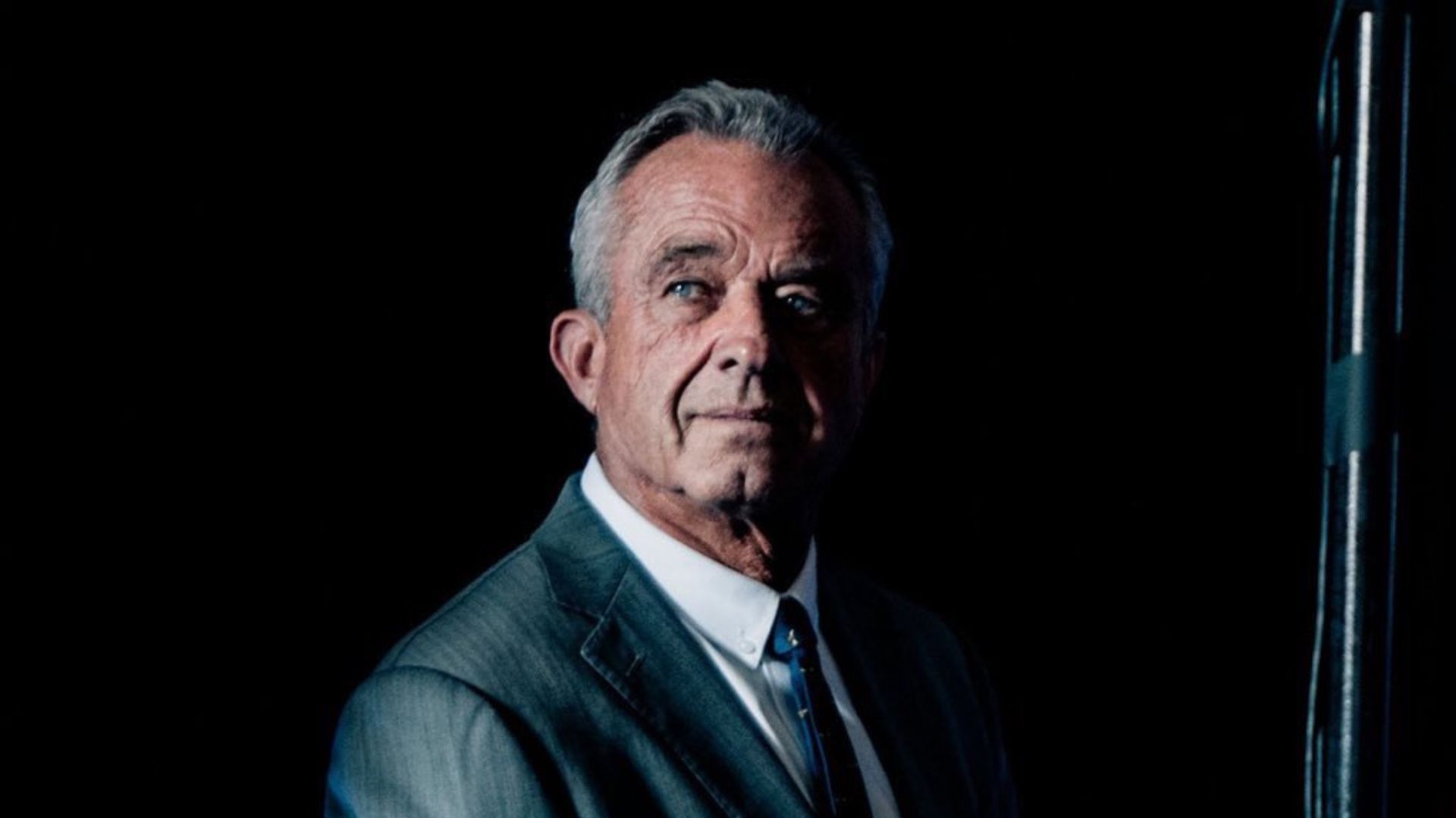 A man wearing a grey suit