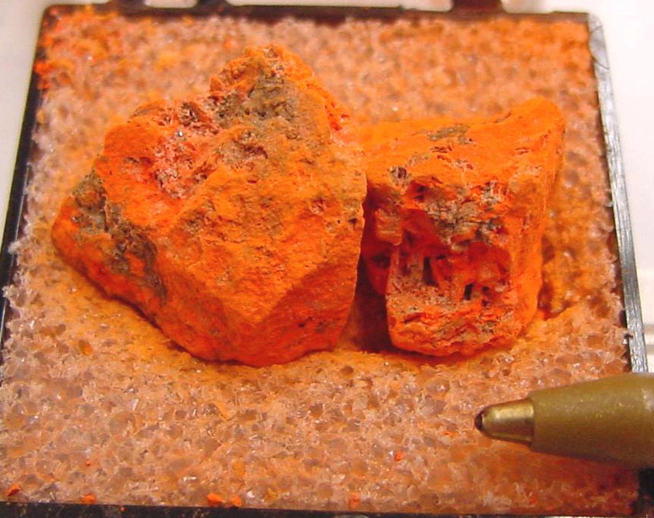 A photograph of a large chunk of lead oxide