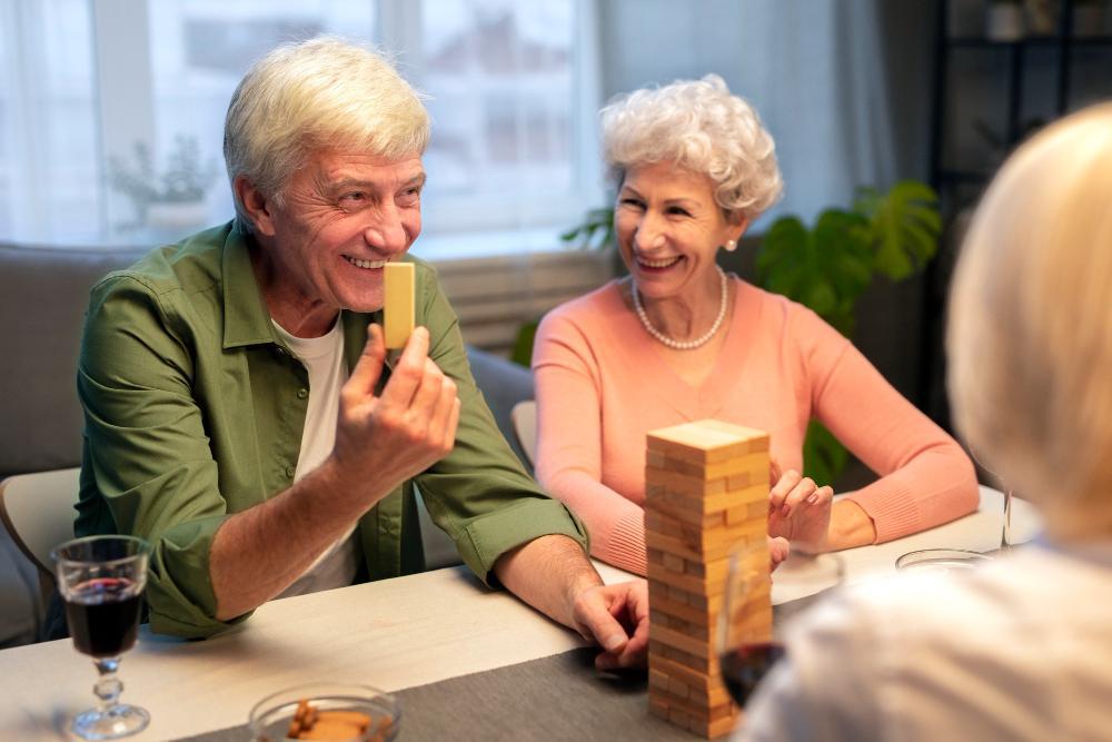 A photograph of an older couple playing a game