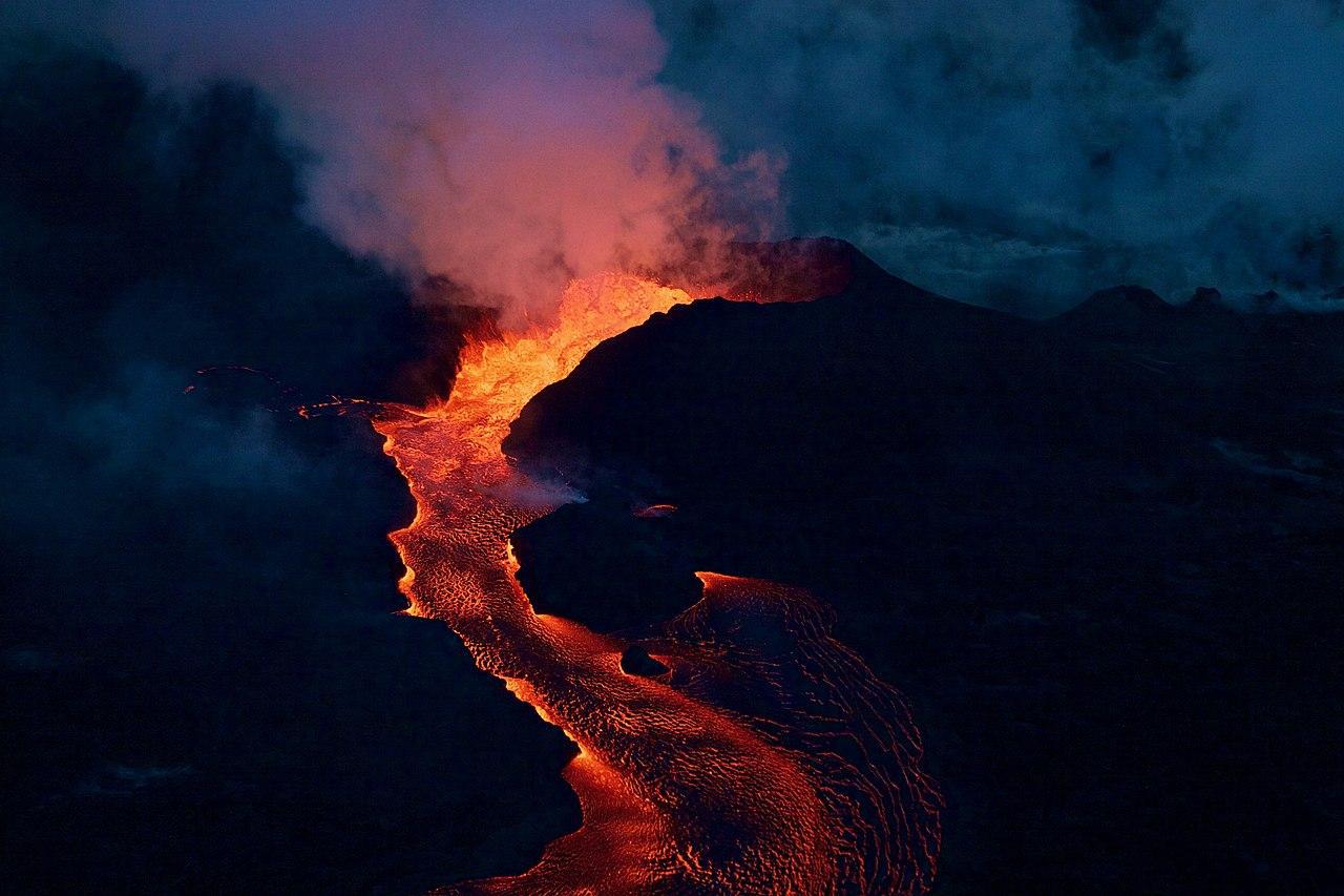 A photograph of a large volcano erupting