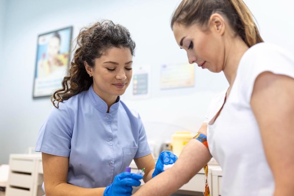 A photograph of a woman getting an injection